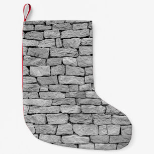 Grey stone wall as an abstract background. small christmas stocking