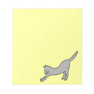 Grey Stretching Cat on Yellow Notepad