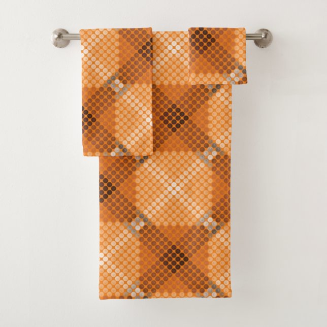 Grey to brown circles over orange, forming squares bath towel set (Insitu)