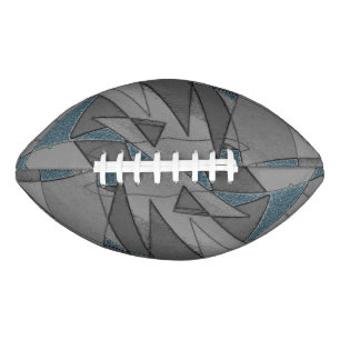 Grey triangle cutouts with rough dark blue pieces american football