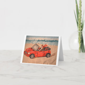 Greyhound in red  convertible car at the Beach Invitation