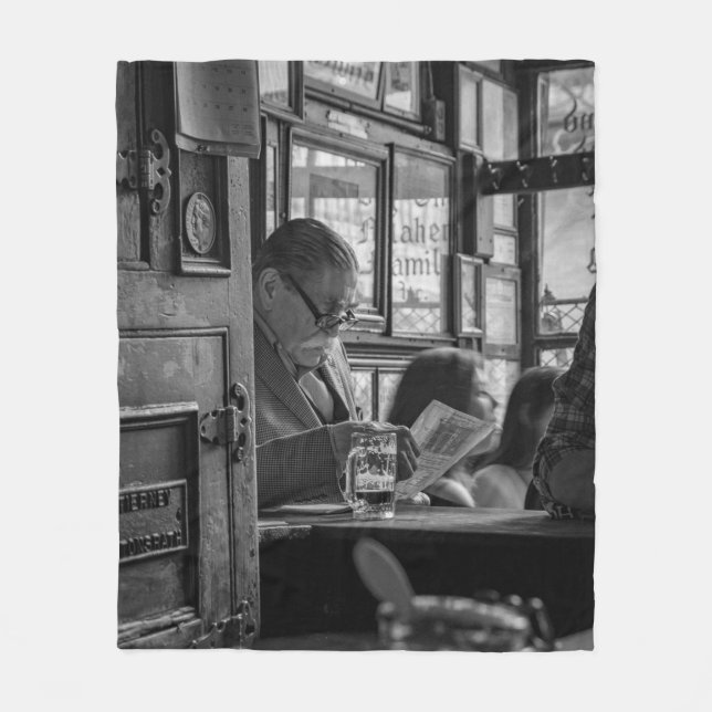 GREYSCALE PHOTO OF MAN SITTING WHILE READING NEWSP FLEECE BLANKET (Front)