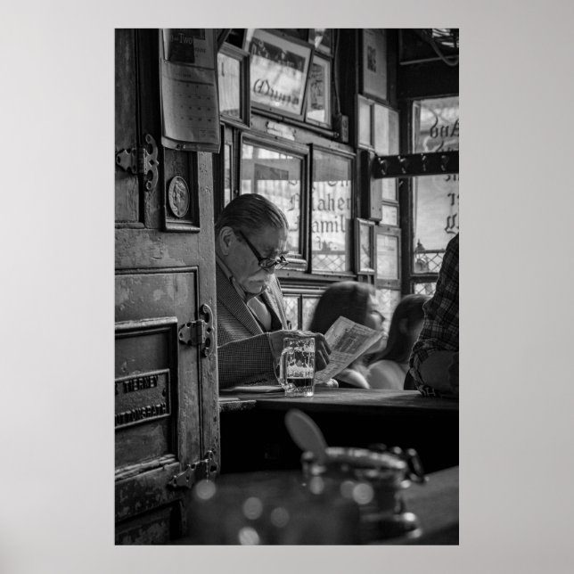GREYSCALE PHOTO OF MAN SITTING WHILE READING NEWSP POSTER (Front)