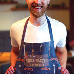 Grill Master Navy Blue Sausage Grilling Fork Name Apron<br><div class="desc">This cool and modern pattern is perfect for the grilling master. It features a hand-drawn brown, tan, silver, black, and dark gold sausage with a grill fork cartoon illustration pattern on top of a navy blue abstract pattern. This design also features the phrase, "Grill Master, " with a monogram name....</div>