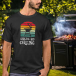 Grilling and Chilling BBQ T-Shirt<br><div class="desc">With a BBQ grill on colourful stripes and the words "Grilling and Chilling, " this t-shirt is a perfect gift for the men in your life,  for father's day,  Christmas,  or his birthday. MATCHING items in our collection.</div>