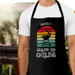 Grilling and Chilling Personalised Apron<br><div class="desc">Black personalised apron features a BBQ grill on stripes with the words "Grilling and Chilling". Perfect gift for father's day or for his birthday.</div>
