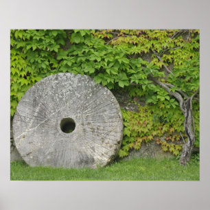 Grinding stone, Castle Banfi in Tuscany region, Poster