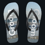 Groom Ocean Waves Beach Sand Flip Flops<br><div class="desc">Pretty Blue Sky with Light Fluffy White Clouds, Blue Sea, Crashing Ocean Waves and Beach Sand. Unisex Flip Flops with Groom and Date of Marriage written in a white colour text. PERSONALIZE with your Wedding DATE (or delete text). The wedding date is written in the sand. Shown with Wide Black...</div>