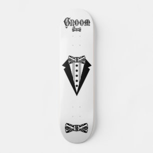 Groom with Bow Tie and Tux and Black Type Skateboard