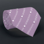 Groomsman Repeating White Text on Lavender Tie<br><div class="desc">This fun neck tie is the perfect accessory for the groomsmen at your wedding. It features a simple yet elegant design with the word "groomsman" written in fancy all capital white text repeating in a diagonal pattern on a light purple or lavender coloured background. Perfect way to add a bit...</div>