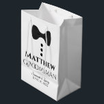 Groomsman Wedding Gift Bag with Black Tie<br><div class="desc">This gift bag is designed for your groomsmen. The design features black text and a black tie with buttons on a white background. Includes a space for his name as well as the name of the couple and the wedding date. Fill with gifts, favors, candy, booze, or any other sort...</div>