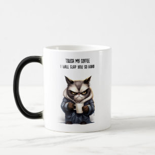 Grumpy cat with cup of coffee