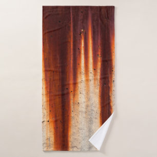 Grunge wall background with sags of rust bath towel