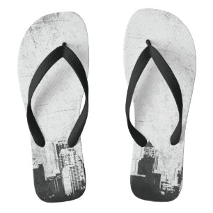 Grungy city background in black and white flip flops