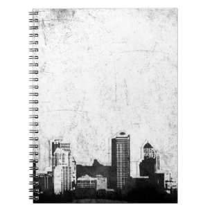 Grungy city background in black and white notebook