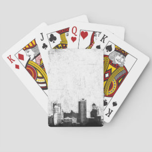 Grungy city background in black and white playing cards