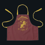 GRYFFINDOR™ Determination Courage Bravery Crest Apron<br><div class="desc">Show your house pride with this bold Gryffindor™ crest design, celebrating the values that define the bravest of witches and wizards. Featuring the iconic lion standing proudly before a shield, this striking artwork highlights Gryffindor’s core traits — Courage, Determination, and Bravery — in a powerful, vintage-inspired layout. The rich house...</div>