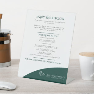 Guest kitchen dark green property rental business  pedestal sign