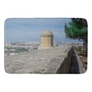 Gun turret on old city walls in Valletta, Malta Bath Mat