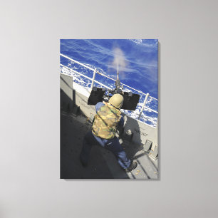 Gunners Mate firing a 50 calibre machine gun Canvas Print