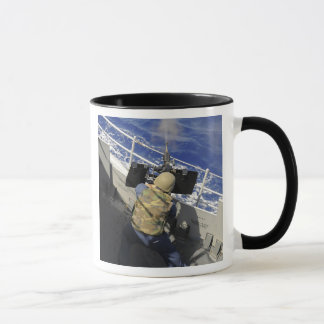 Gunners Mate firing a 50 calibre machine gun Mug