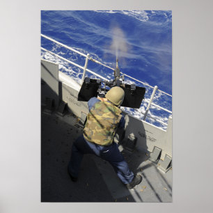 Gunners Mate firing a 50 calibre machine gun Poster