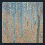 Gustav Klimt Beech Tree Forest Grove Stone Coaster<br><div class="desc">This is based on classic nature painting artworks by Gustav Klimt, Beech Grove 1, 1902. The artwork portrays a dense forest of tall, slender birch trees, with pale trunks marked by dark, vertical lines. The foliage is depicted in shades of blue, green, and yellow, adding a sense of depth and...</div>