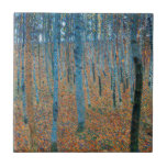 Gustav Klimt Beech Tree Forest Grove Tile<br><div class="desc">This is based on classic nature painting artworks by Gustav Klimt, Beech Grove 1, 1902. The artwork portrays a dense forest of tall, slender birch trees, with pale trunks marked by dark, vertical lines. The foliage is depicted in shades of blue, green, and yellow, adding a sense of depth and...</div>