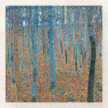 Gustav Klimt Fir Forest Tannenwald Red Trees Glass Coaster<br><div class="desc">Vintage Gustav Klimt Fir Forest - Art Nouveau Red Trees This beautiful vintage paintings of trees is by master artist Gustav Klimt. The painting, called Fir Forest I, or Tannenwald, shows us a beautiful landscape with Red Fir Trees, through a dense forest. Gustav Klimt captured the feeling of vibrance in...</div>