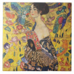 Gustav Klimt Lady With Fan Art Nouveau Painting Tile<br><div class="desc">Gustav Klimt Lady With Fan Art Nouveau Painting This half portrait of a beautiful woman shows a yellow background with asiatic ornaments, colourful birds and lotus flowers. The lady wears a dress in the style of a kimono imprinted with motives of a Chinese dragon dress. Beautiful artistic romantic decorative fine...</div>