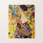 Gustav Klimt Lady with Fan Jigsaw Puzzle<br><div class="desc">Puzzle featuring Gustav Klimt’s oil painting Lady with Fan (1918). A woman wearing a blue kimono holds a red fan against a colorful yellow background of flowers and peacocks. A great gift for fans of Japonisme and European art.</div>