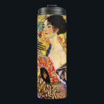 Gustav Klimt Lady with Fan Thermal Tumbler<br><div class="desc">Thermal Tumbler featuring Gustav Klimt’s oil painting Lady with Fan (1918). A woman wearing a blue kimono holds a red fan against a colourful yellow background of flowers and peacocks. A great gift for fans of Japonisme and European art.</div>