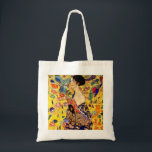 Gustav Klimt Lady with Fan Tote Bag<br><div class="desc">Tote Bag featuring Gustav Klimt’s oil painting Lady with Fan (1918). A woman wearing a blue kimono holds a red fan against a colourful yellow background of flowers and peacocks. A great gift for fans of Japonisme and European art.</div>