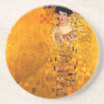 Gustav Klimt Portrait of Adele Bloch Bauer Coaster<br><div class="desc">Sandstone Coaster featuring Gustav Klimt’s oil painting Portrait of Adele Bloch Bauer I (1907). A beautiful woman wears a golden and geometric dress in front of a gold background. A great gift for fans of Art Nouveau and Austrian art.</div>