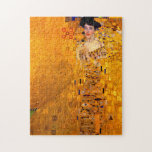 Gustav Klimt Portrait of Adele Bloch Bauer Jigsaw Puzzle<br><div class="desc">Puzzle featuring Gustav Klimt’s oil painting Portrait of Adele Bloch Bauer I (1907). A beautiful woman wears a golden and geometric dress in front of a gold background. A great gift for fans of Art Nouveau and Austrian art.</div>