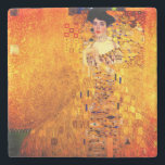 Gustav Klimt Portrait of Adele Bloch Bauer Stone Coaster<br><div class="desc">Stone Coaster featuring Gustav Klimt’s oil painting Portrait of Adele Bloch Bauer I (1907). A beautiful woman wears a golden and geometric dress in front of a gold background. A great gift for fans of Art Nouveau and Austrian art.</div>