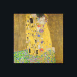 Gustav Klimt The Kiss Canvas Print<br><div class="desc">The Kiss is the most iconic and famous painting by Gustav Klimt. It's a beautiful golden painting of a couple deeply in love sharing a romantic moment of a passionate kiss. Get your high quality gift ideas and wonderful products featuring this wonderful masterpiece. Check out our store fore more Klimt...</div>