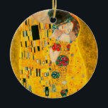 Gustav Klimt The Kiss Ceramic Tree Decoration<br><div class="desc">Ornament featuring Gustav Klimt’s oil painting with gold leaf The Kiss (1908). A man and woman,  wearing brilliant golden colours,  lovingly embrace and kiss in a field of flowers. A great gift for fans of Art Nouveau and Austrian art.</div>