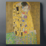 Gustav Klimt "The Kiss" Plaque<br><div class="desc">Gustav Klimt 's masterpiece: "The Kiss". “The Kiss, ” created by the Austrian painter Gustav Klimt. It’s considered to be his most famous work. He painted it between the years 1907 and 1908, which were the highpoint of his “Golden Period, ” when he painted a number of works utilising gold...</div>