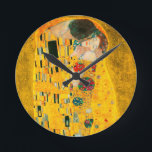 Gustav Klimt The Kiss Round Clock<br><div class="desc">Clock featuring Gustav Klimt’s oil painting with gold leaf The Kiss (1908). A man and woman,  wearing brilliant golden colours,  lovingly embrace and kiss in a field of flowers. A great gift for fans of Art Nouveau and Austrian art.</div>