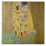 Gustav Klimt The Kiss Tile<br><div class="desc">The Kiss is the most iconic and famous painting by Gustav Klimt. It's a beautiful golden painting of a couple deeply in love sharing a romantic moment of a passionate kiss. Get your high quality gift ideas and wonderful products featuring this wonderful masterpiece. Check out our store fore more Klimt...</div>
