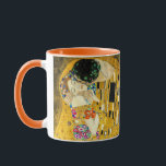 Gustav Klimt - The Kiss / Valentine's Day Mug<br><div class="desc">The Kiss (in German Der Kuss) is an oil-on-canvas painting with added gold leaf, silver and platinum by the Austrian symbolist painter Gustav Klimt. The painting depicts a couple embracing each other, their bodies entwined in elaborate beautiful robes decorated in a style influenced by the contemporary Art Nouveau style and...</div>