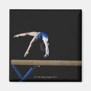 Gymnast (9-10) flipping on balance beam, side magnet