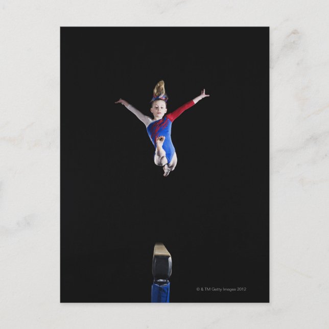 Gymnast (9-10) leaping on balance beam postcard (Front)