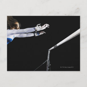 Gymnast (9-10) reaching for uneven bars 2 postcard