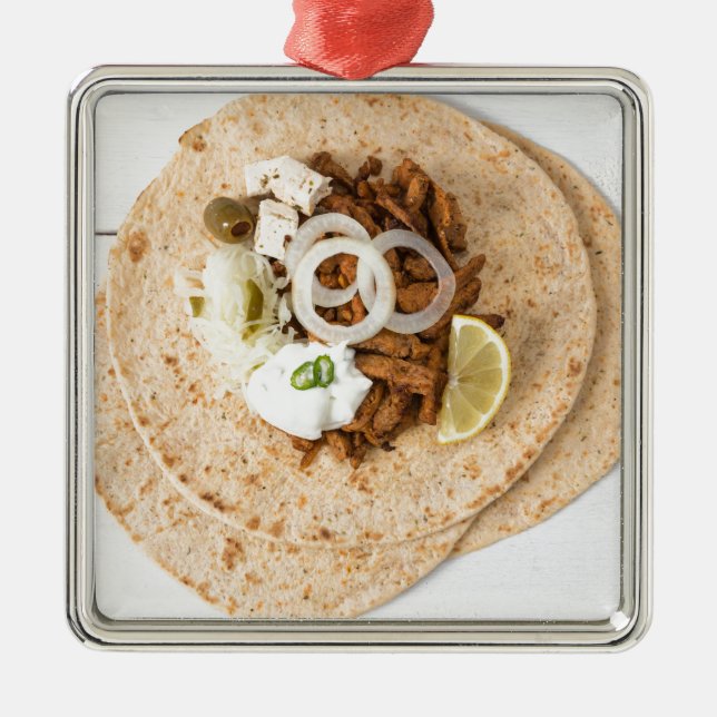 Gyros pita with tzatziki coleslaw olives and feta metal tree decoration (Front)