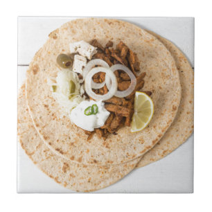 Gyros pita with tzatziki coleslaw olives and feta tile