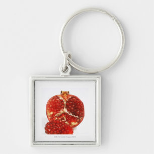 Half a ripe pomegranate cut to expose the juicy key ring