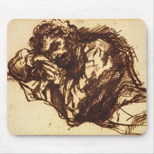 Half length portrait of a man bending over mouse mat