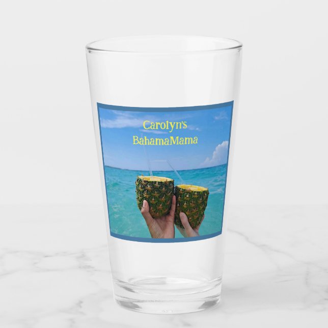 Half pineapples filled with punch, on the beach glass (Front)